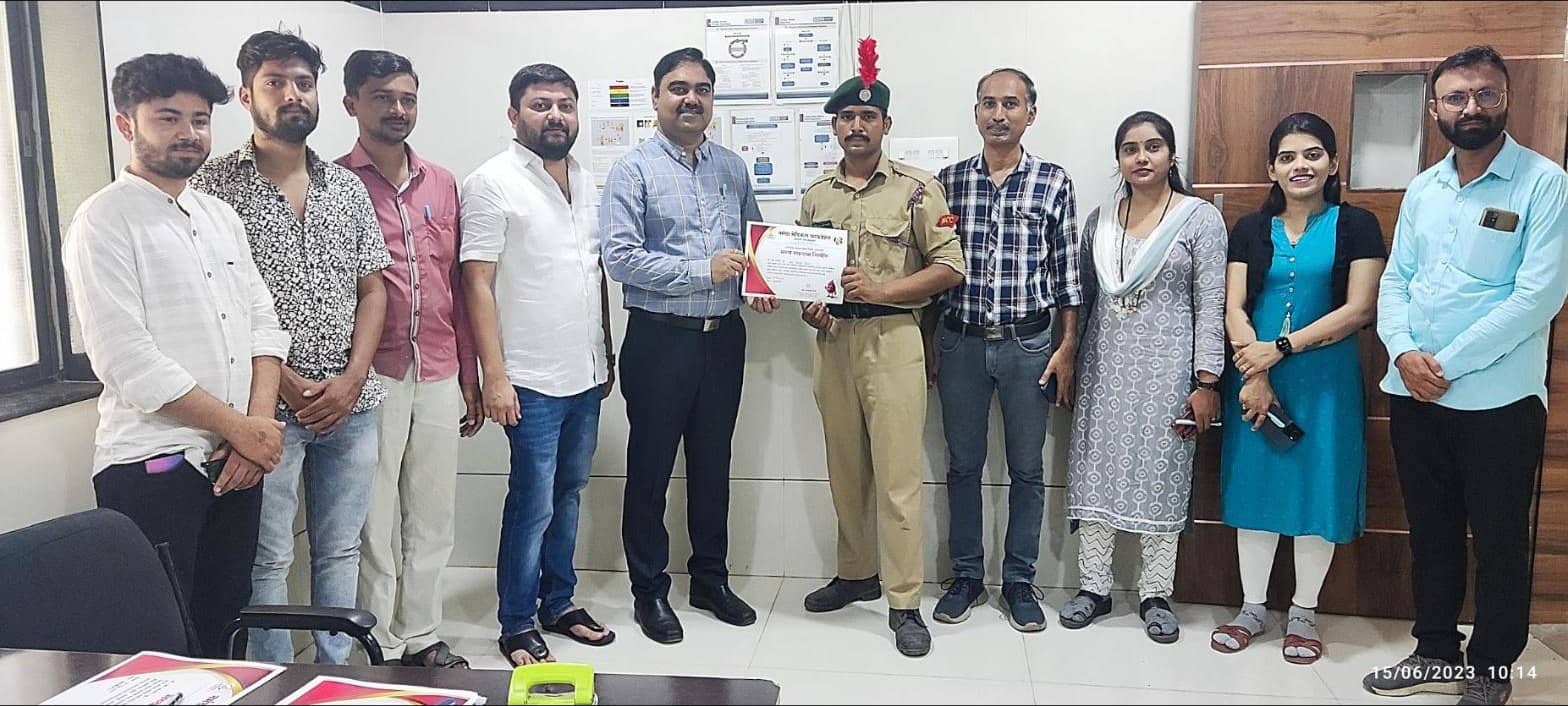 Hospital team presenting a certificate to an NCC cadet blood donor